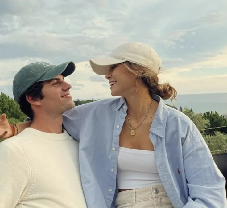 Happy couple smiling at each other in nature